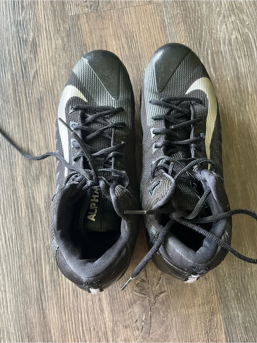 Nike Menace Men’s Black Cleats with White Swoosh